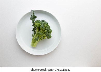 Broccoli Crown On Oval Plate On White Background