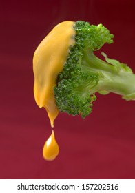 Broccoli Dipped In Cheese Sauce