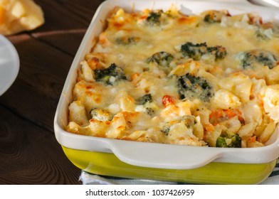 Broccoli And Pumpkin Mac And Cheese In A Ceramic Dish On A Wooden Background. Close Up.