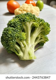 broccoli with vegetables in the background, shoot from the front angel