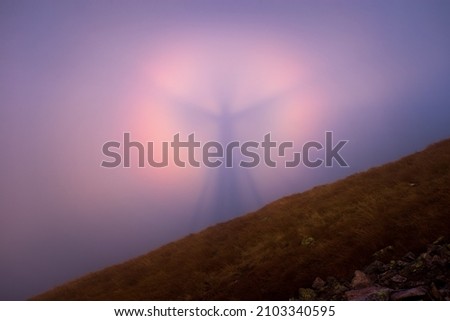 Brocken spectre in Tatra Mountains at sunset, Poland