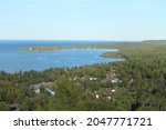 Brockway Mountain Overlook of Copper Harbor Michigan.  This view offers a glimpse of Copper Harbor lighthouse as well as the quiet little town full of houses and business.