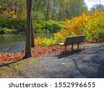 Brodhead Creek, in the fall with empty bench, is a 21.9-mile-long tributary of the Delaware River in the Poconos of eastern Pennsylvania in the United States.
