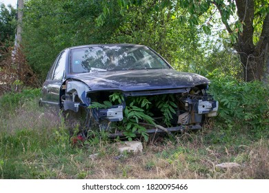 Broken Abandoned Car. Old Vehicle Running And Aging. Antique Damaged Automobile. Forgotten Wrecked Junk Car. 