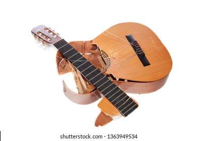 Broken Acoustic Guitar Smashed To Pieces. Frustrated Angry Musician. Demolished Classical Musical Instrument Destroyed By A Music Student Guitarist. Isolated Against White Background.