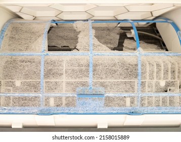 The Broken Air Filter Of The Air Conditioning Unit After Long Use In The Urban House, Front View With The Copy Space.