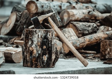 broken axe when chopping wood. The woodcutter broke the tool. - Powered by Shutterstock