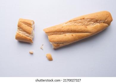 Broken Baguette On A White Background.