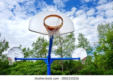 Broken Basketball Net With Orange Hoop At Park. Community Service, Repair, City Facilities And Teen Activities Concept.