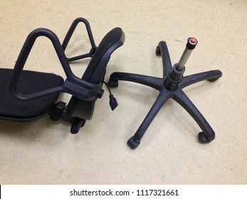 Broken Black Chair On Floor