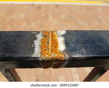 Broken Black Metal Railing With Rust And Welding