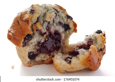 Broken Blueberry Muffin On White Surface