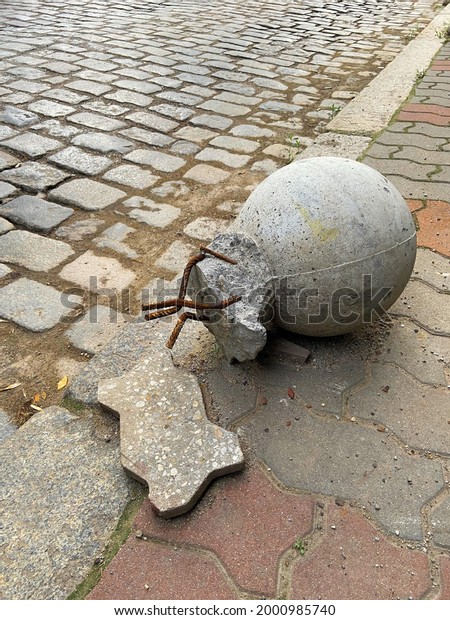 Broken bollard - anti-parking pole - ball on the\
pedestrian sidewalk