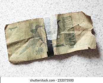 Broken brazilian banknote with background. Real. Horizontal - Shutterstock ID 232073500