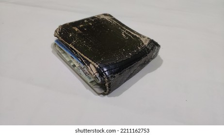 Broken Brown Wallet On The White Background 