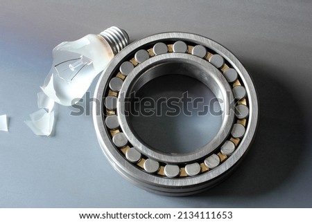 broken bulb and ball bearing