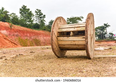 Broken Cable Spool Or Old Wooden Steel Cable Reel On The Outdoor Floor