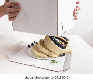 Broken Cake Inside The Box On White Background. Bad Delivery Concept. Spoiled Birthday, Wedding. Bad Luck. Copy Space For Text