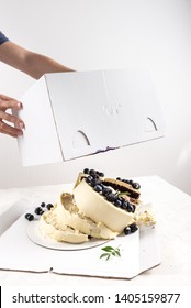 Broken Cake Inside The Box On White Background. Bad Delivery Concept. Spoiled Birthday, Wedding. Bad Luck. Copy Space For Text