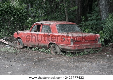broken car in abandoned forest red background landscape wallpaper
