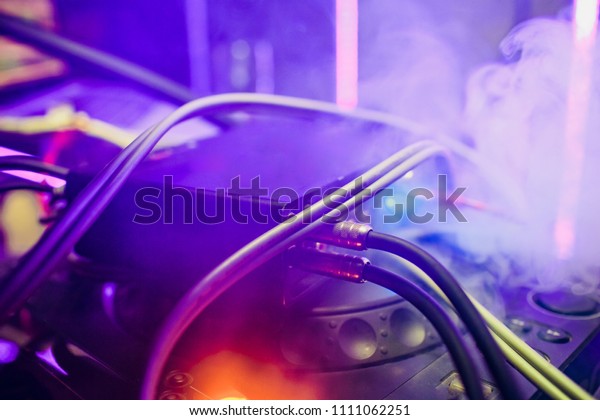 broken car audio\
player in garage and\
smoke