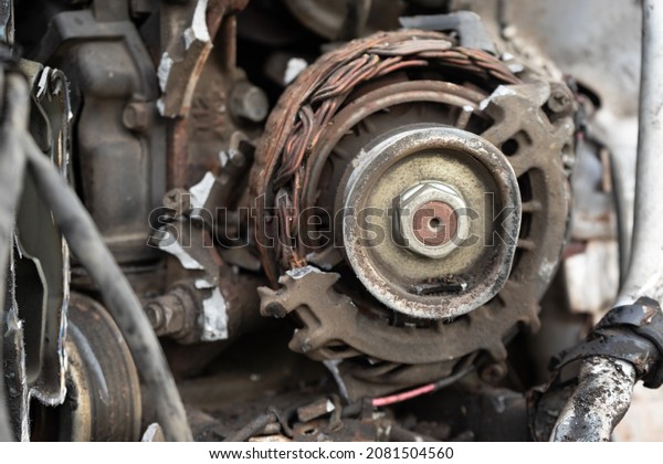 broken car generator. the old generator is on the
engine of the car