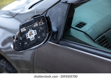 A Broken Car Mirror On A Passenger Car