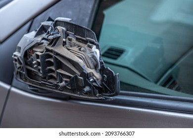 A Broken Car Mirror On A Passenger Car