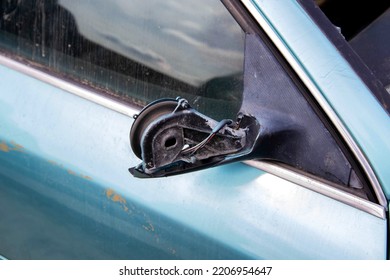 Broken Car Mirror On A Car. Vandalism And Hooliganism.