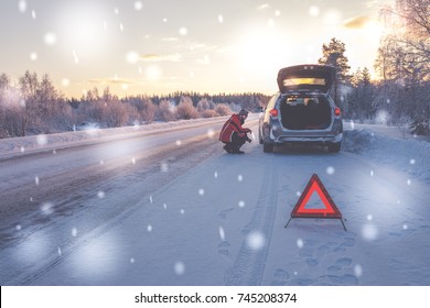 Broken Car On A Snowy Winter Road