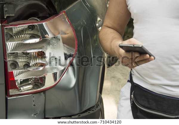 A broken car, the owner who stands
nearby, and dials an insurance numberThe car after the accident,
the host in indignation is pouring out
palicies