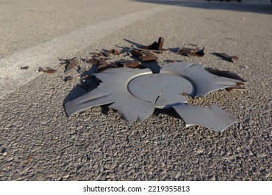 Broken Car Parts On The Road After A Crash