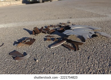 Broken Car Parts On The Road After A Crash