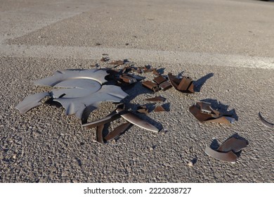 Broken Car Parts On The Road After A Crash