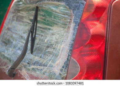 Broken Car Rear Window Sealed With Scotch Tape