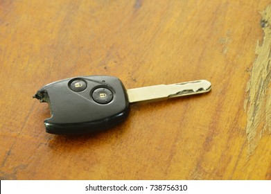  Broken Car Remote Key On Wooden Table