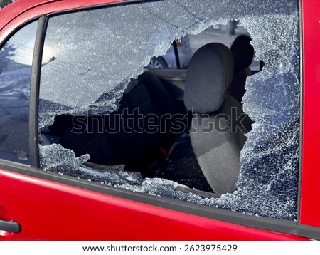 Broken car side window after theft