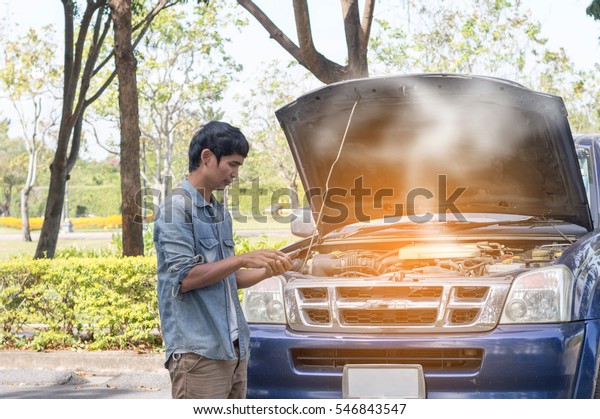 Broken car with\
smoke