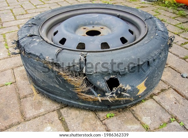Broken car\
wheel. The wheel after the\
accident.