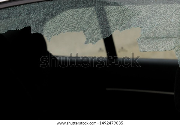 Broken car
window and cracked glass of a
automobile
