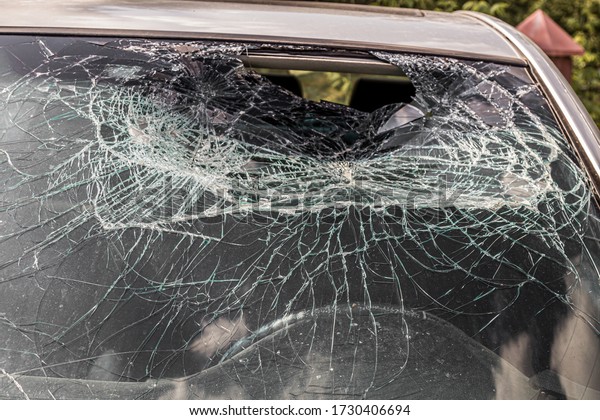 Broken car windshield.\
Accident of car.