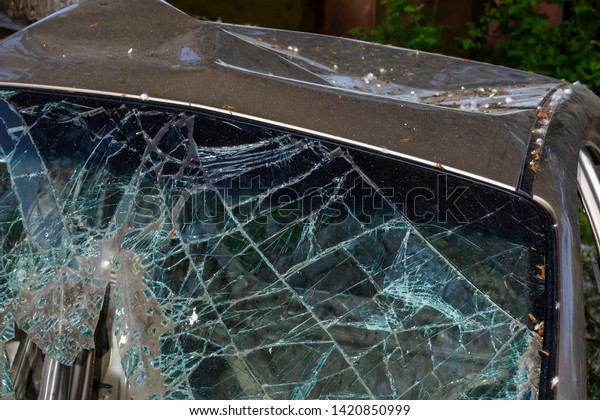 Broken car windshield\
after an accident