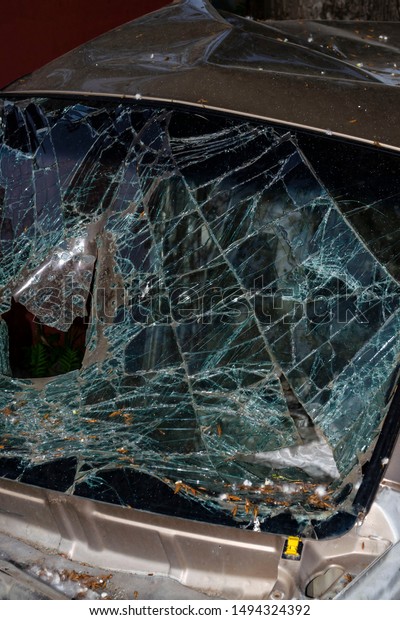 Broken car windshield\
after an accident