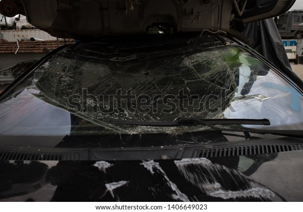 Broken car windshield, in a car graveyard,\
Kozani, Greece.