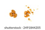 Broken caramel candies isolated, toffee caramel crumbs, round hard milk confectionery pieces, brown sugar candies, small caramel sweets on white background