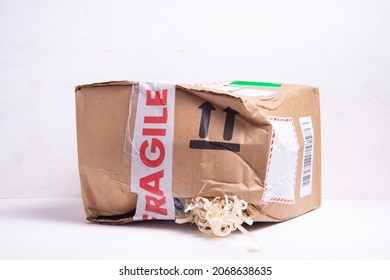 Broken Cardboard Box, Fragille Marked Parcel