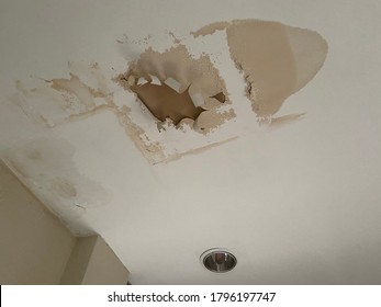 Broken Ceiling Problem In House Because Rain Water Damage In Raining Season. Ceiling Panels Damaged Huge Hole In Roof From Rainwater Leakage.