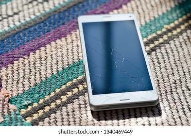 Broken Cell Phone Glass Screen On The Ground