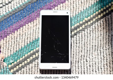 Broken Cell Phone Glass Screen On The Ground