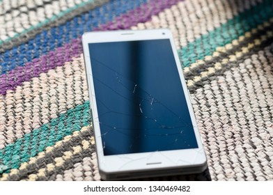 Broken Cell Phone Glass Screen On The Ground